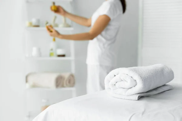 depositphotos_306600434-stock-photo-selective-focus-white-towel-massage